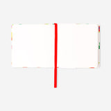 Mini sketchbook with fabric cover by Flying Tiger Copenhagen, featuring blank pages for drawing and sketching.