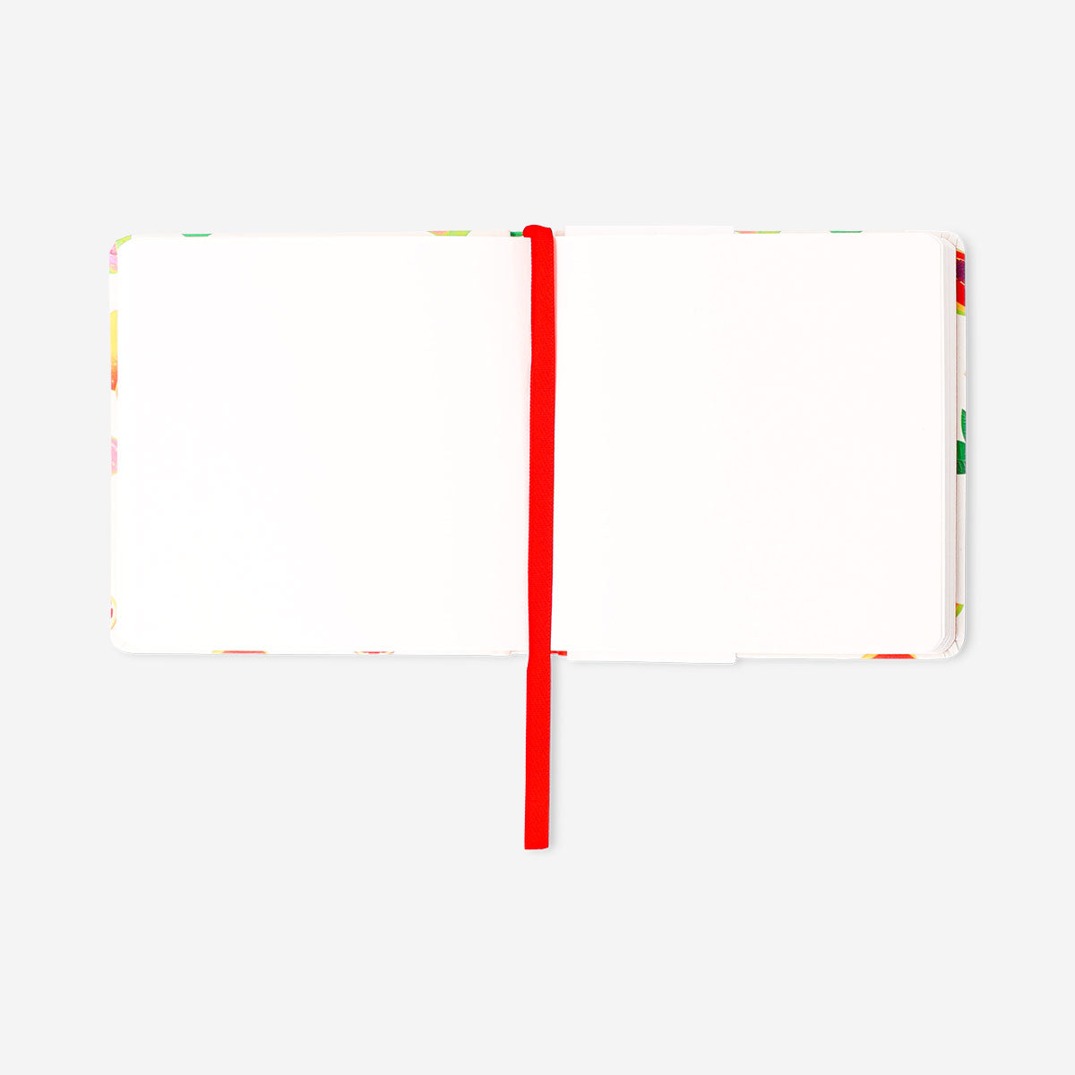Mini sketchbook with fabric cover by Flying Tiger Copenhagen, featuring blank pages for drawing and sketching.