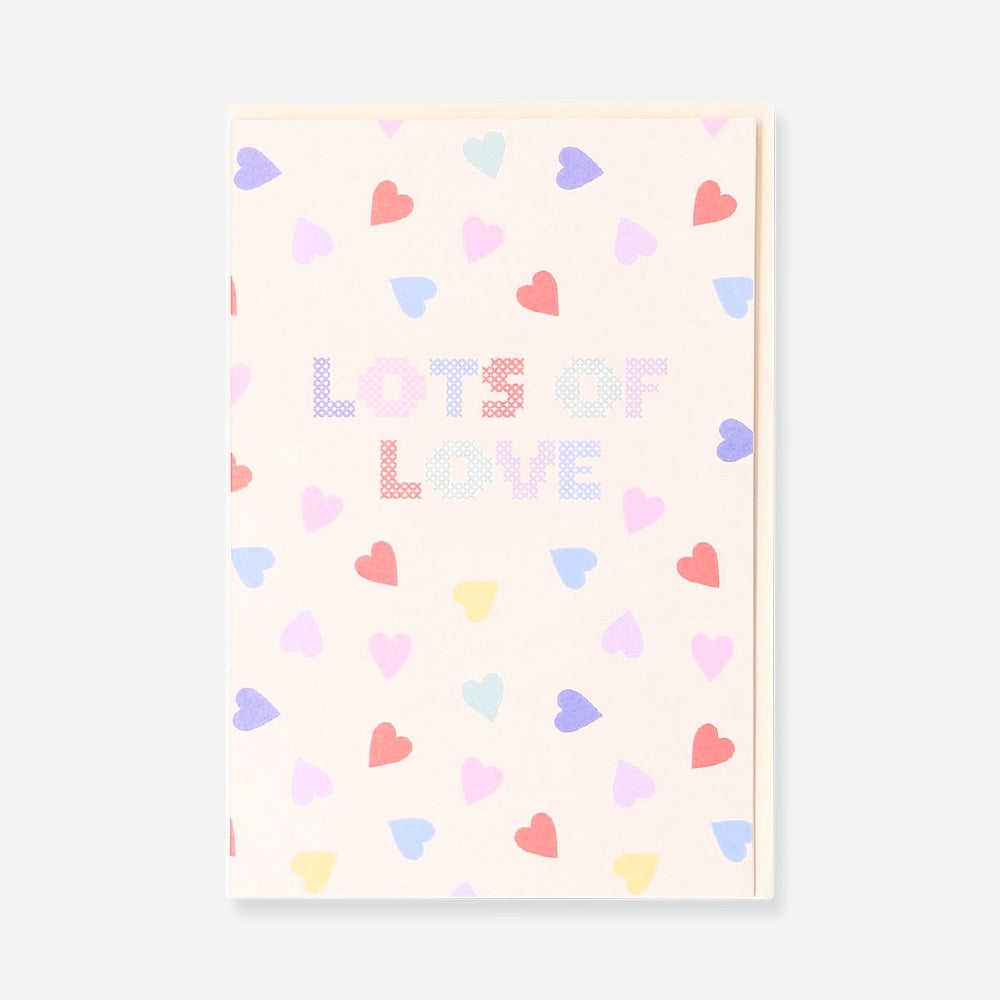 Flying Tiger Copenhagen greeting card featuring "Lots of Love" with heart illustrations, ideal for sending heartfelt messages.