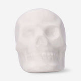 Set of three white skull tealight candles for home décor, featuring detailed skull designs by Flying Tiger Copenhagen.