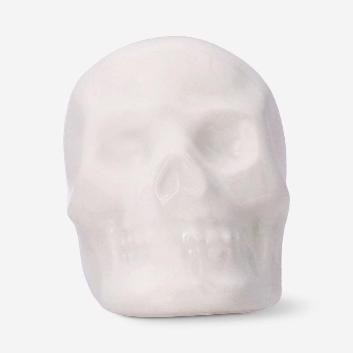 Set of three white skull tealight candles for home décor, featuring detailed skull designs by Flying Tiger Copenhagen.