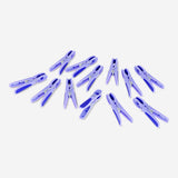 Blue flower-shaped clothes pegs, 12-pack from Flying Tiger Copenhagen, shown clipped onto a clothesline for hanging laundry.