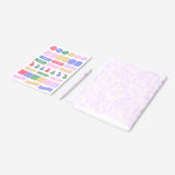 Floral Flying Tiger Copenhagen office notebook with matching ballpoint pen and colorful stickers on a desk.
