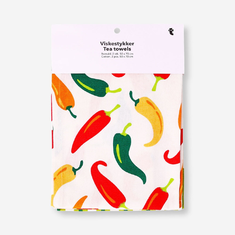 Set of two Flying Tiger Copenhagen kitchen tea towels featuring chili and stripe patterns, perfect for adding color to your kitchen.