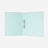 Green office ring binder from Flying Tiger Copenhagen with metal rings and a smooth cover for organizing documents.