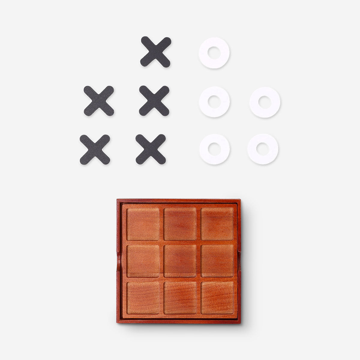 Wooden Tic Tac Toe game by Flying Tiger Copenhagen featuring a classic grid and wooden game pieces on a flat surface.