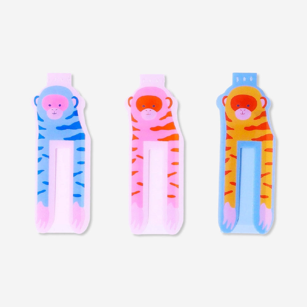 Set of three Flying Tiger Copenhagen magnetic bookmarks featuring playful monkey designs, perfect for marking pages in office or reading materials.
