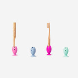 Set of four Flying Tiger Copenhagen fish-shaped toothbrush covers with suction pads, designed for bathroom organization and fun.