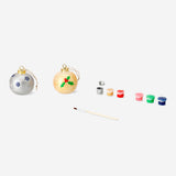 Two DIY ceramic baubles from Flying Tiger Copenhagen, hobby craft decorations, with colorful patterns on smooth ceramic surfaces.