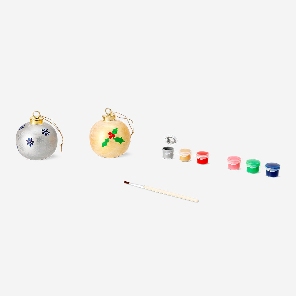 Two DIY ceramic baubles from Flying Tiger Copenhagen, hobby craft decorations, with colorful patterns on smooth ceramic surfaces.