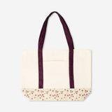 Textile shopper bag with floral pattern and burgundy strap, stylish and spacious shopping tote by Flying Tiger Copenhagen.