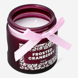 Frosted cranberry scented candle in a glass jar, home fragrance by Flying Tiger Copenhagen, with a frosted finish and festive appearance.