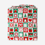 Knitted Christmas throw blanket by Flying Tiger Copenhagen, 120x150 cm, featuring festive red and white holiday patterns.