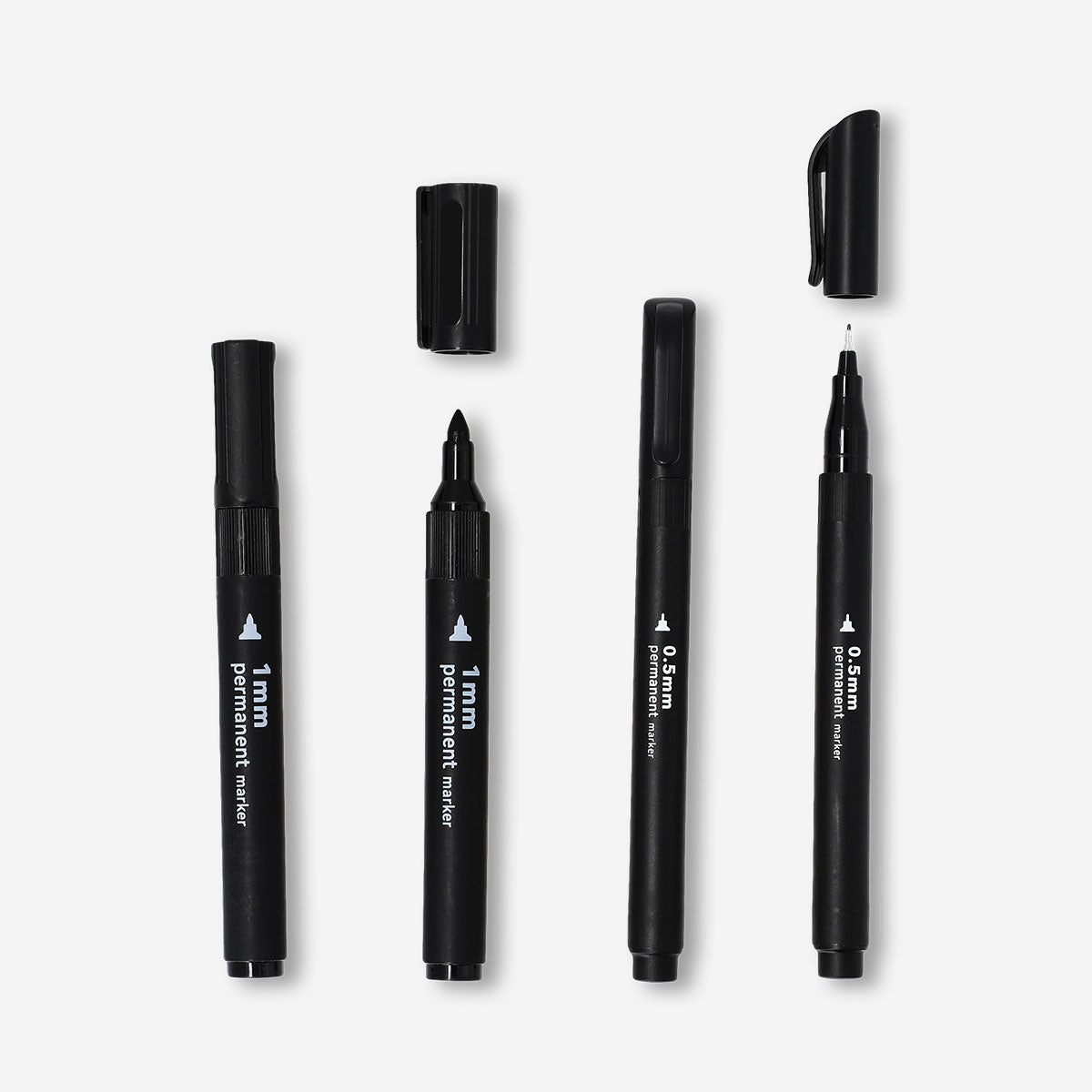Set of four black permanent markers from Flying Tiger Copenhagen, ideal for office writing and labeling tasks.