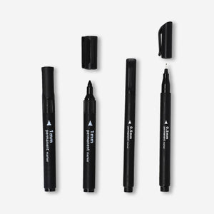 Set of four black permanent markers from Flying Tiger Copenhagen, ideal for office writing and labeling tasks.