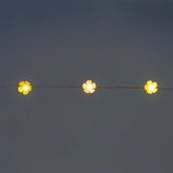 Flying Tiger Copenhagen pink and yellow flower string lights for home decor, featuring floral design and warm ambient lighting.
