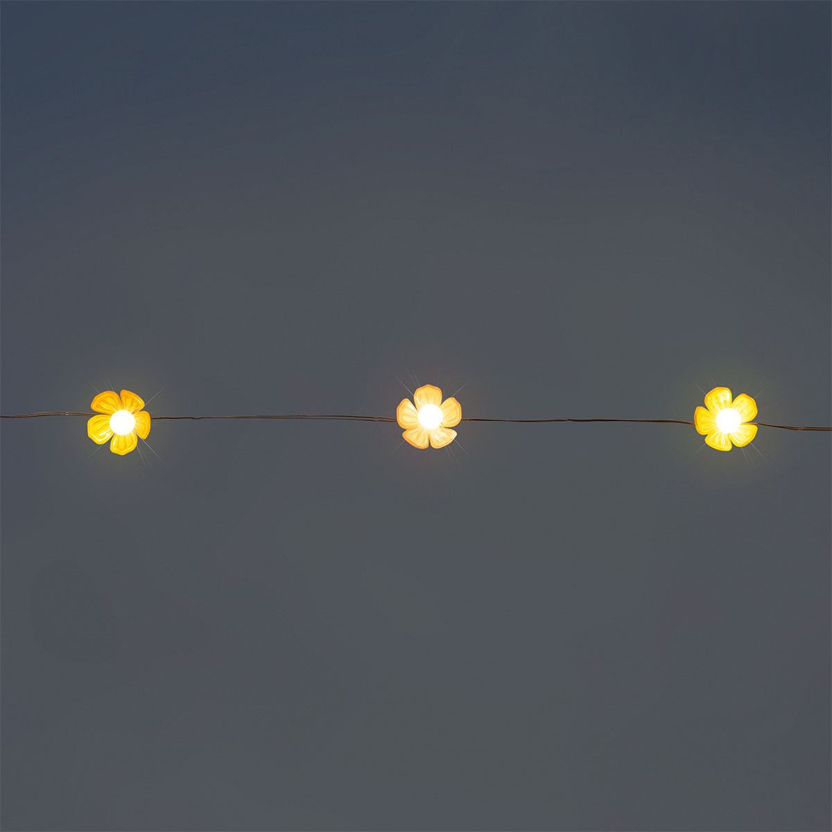 Flying Tiger Copenhagen pink and yellow flower string lights for home decor, featuring floral design and warm ambient lighting.