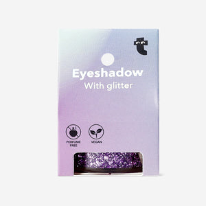 Purple glitter eyeshadow flakes from Flying Tiger Copenhagen, close-up of sparkling, iridescent cosmetic flakes for eye makeup.