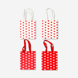 Set of four Flying Tiger Copenhagen gift bags with heart print, ideal for office gifting and special occasions.