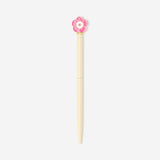 Pink flower topper on a black ballpoint pen from Flying Tiger Copenhagen, perfect for office use.