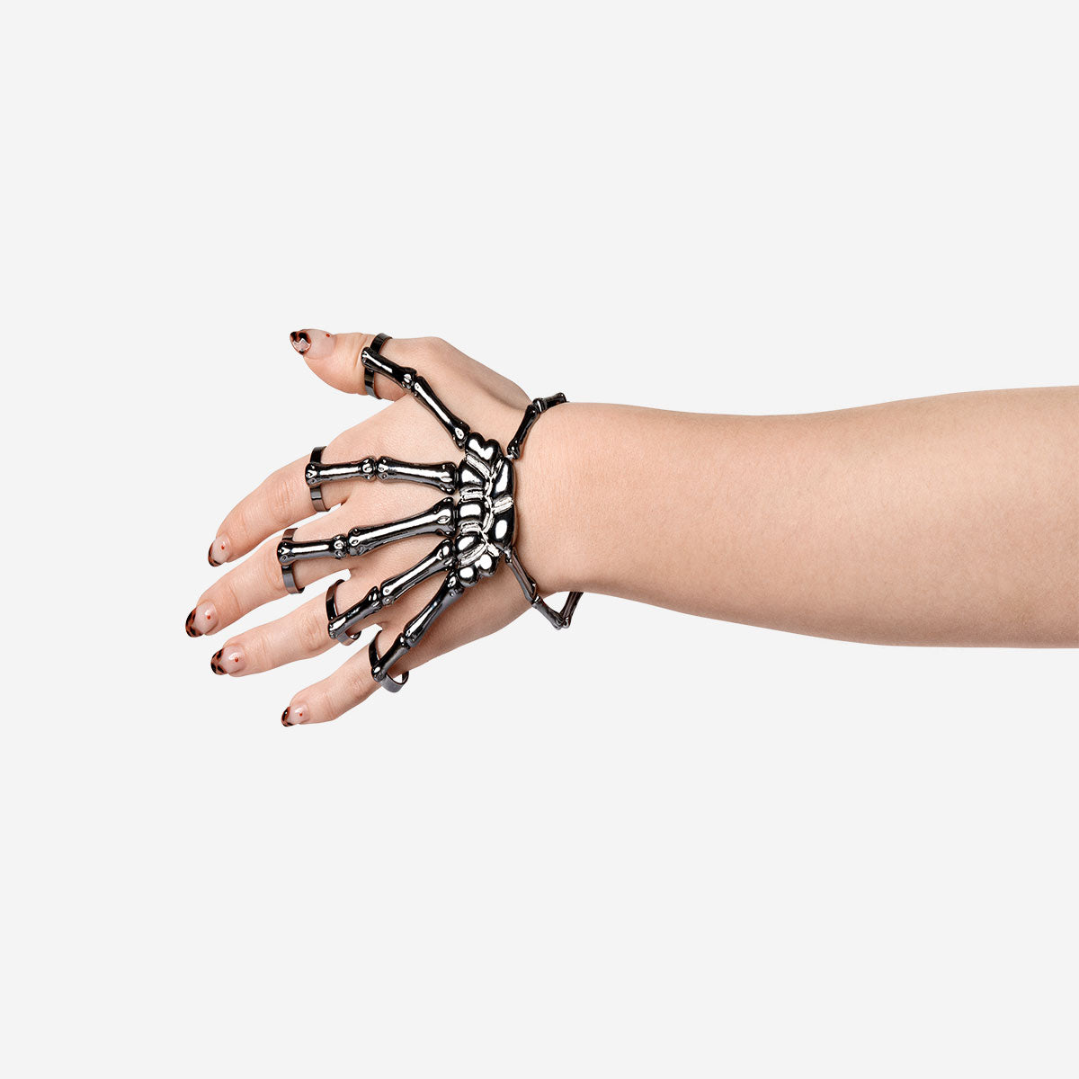 Textile skeleton hand jewelry by Flying Tiger Copenhagen, featuring detailed skeletal hand design on fabric.
