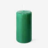 Green 14 cm pillar candle from Flying Tiger Copenhagen, shown on a home decor surface with a simple, modern style.