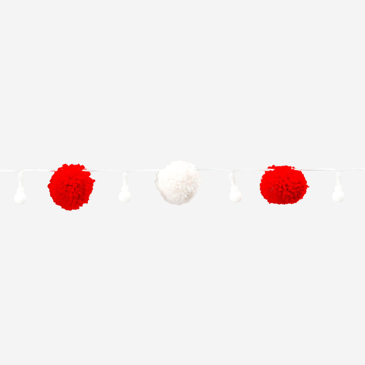 Red and white pompom string lights for home decor, featuring colorful hanging pom-poms from Flying Tiger Copenhagen.