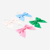 Set of four multicolored velvet hanging bows for home decor by Flying Tiger Copenhagen, featuring vibrant, soft fabric bows.