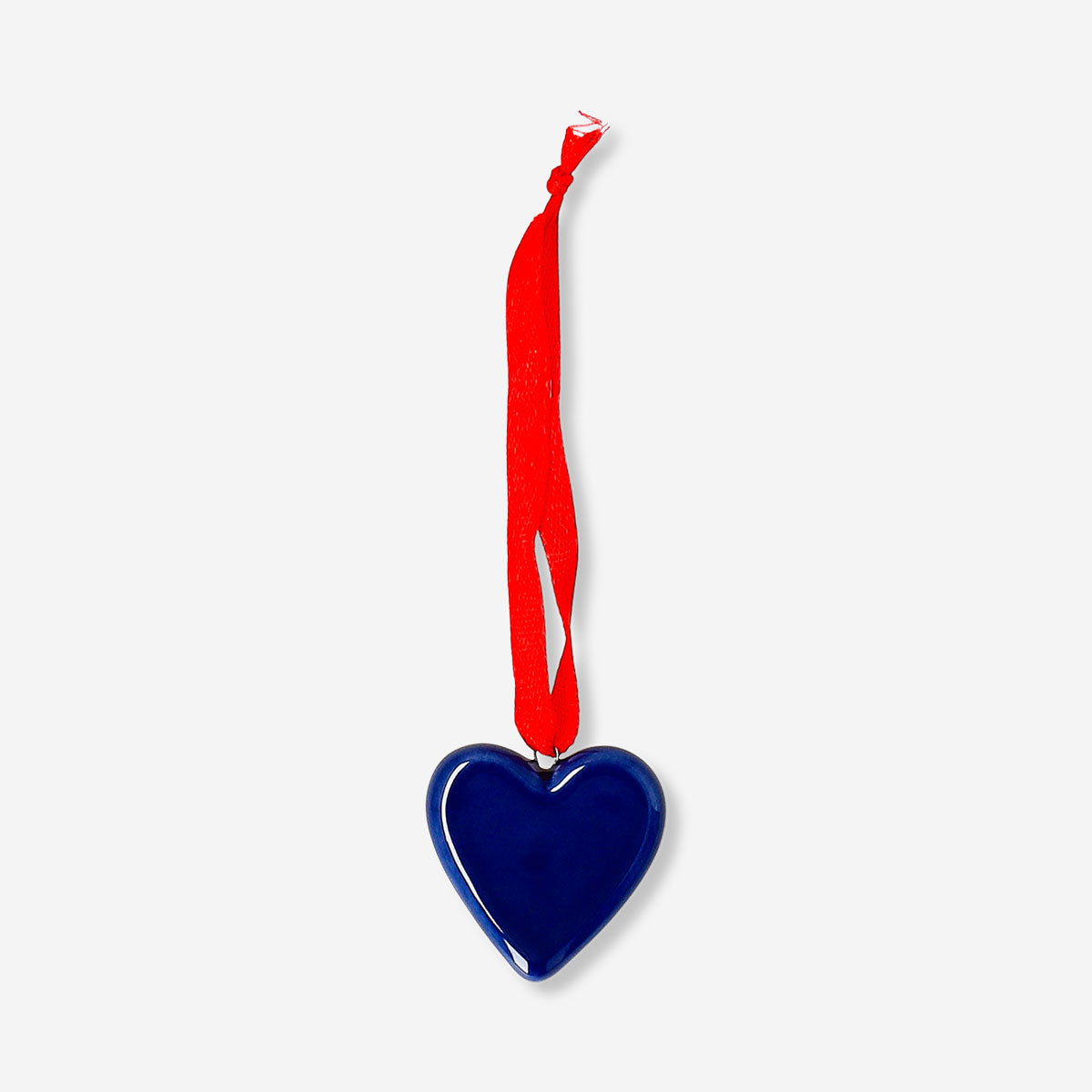 Blue ceramic heart hanging ornament for home decor, by Flying Tiger Copenhagen, with a glossy finish and decorative string.