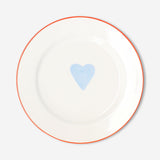 Heart-shaped 21 cm kitchen plate from Flying Tiger Copenhagen, featuring a playful design on a white ceramic surface.
