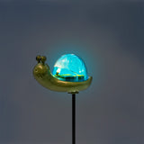 Flying Tiger Copenhagen solar cell snail lamp for home, featuring a whimsical snail design with solar panel details visible.