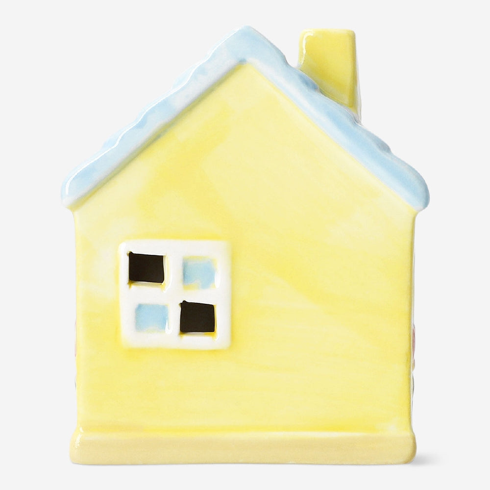 Decorative yellow ceramic house, 13 cm tall, from Flying Tiger Copenhagen, with detailed windows and roof, perfect for home decor.