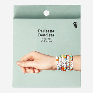 Colorful hobby bead set with tropical-colored beads and letter charms on string by Flying Tiger Copenhagen