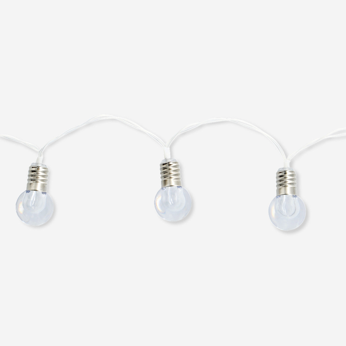 Outdoor string lights with clear bulbs, ideal for home decor, by Flying Tiger Copenhagen, hanging outdoors in a cozy setting.