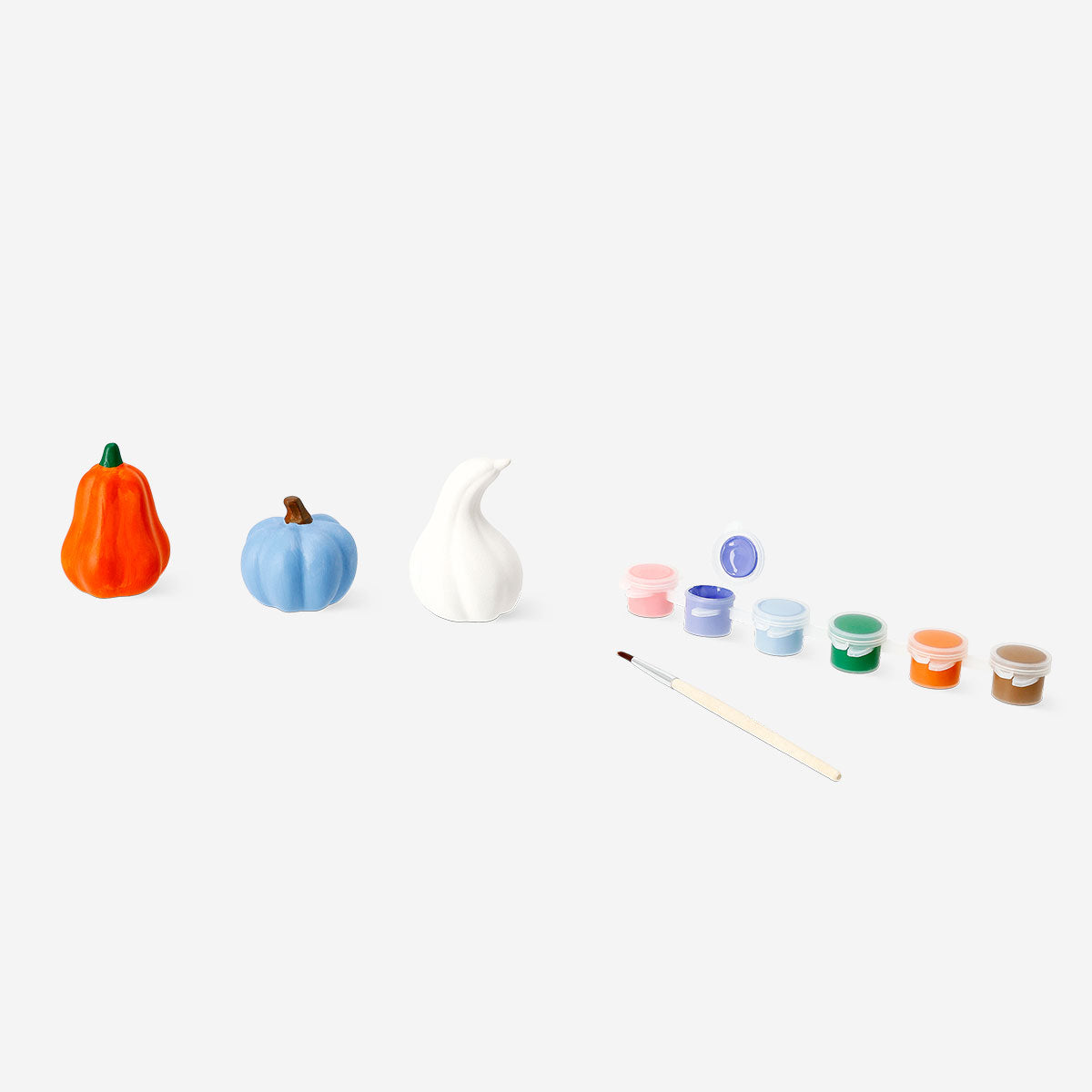 Set of three DIY decorative ceramic pumpkins for craft projects, featuring vibrant orange and neutral tones by Flying Tiger Copenhagen.