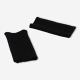 Black fingerless textile gloves by Flying Tiger Copenhagen, one size fits most, shown laid flat with open fingertips.