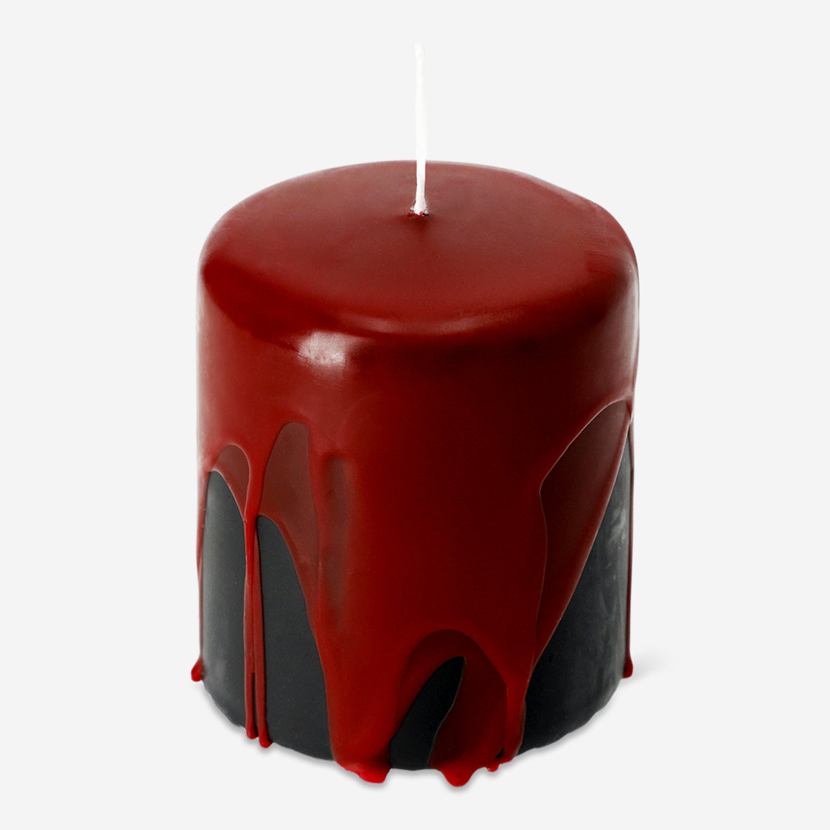 Bleeding pillar candle from Flying Tiger Copenhagen, 8 cm tall, with red wax drips for a dramatic home decor accent.