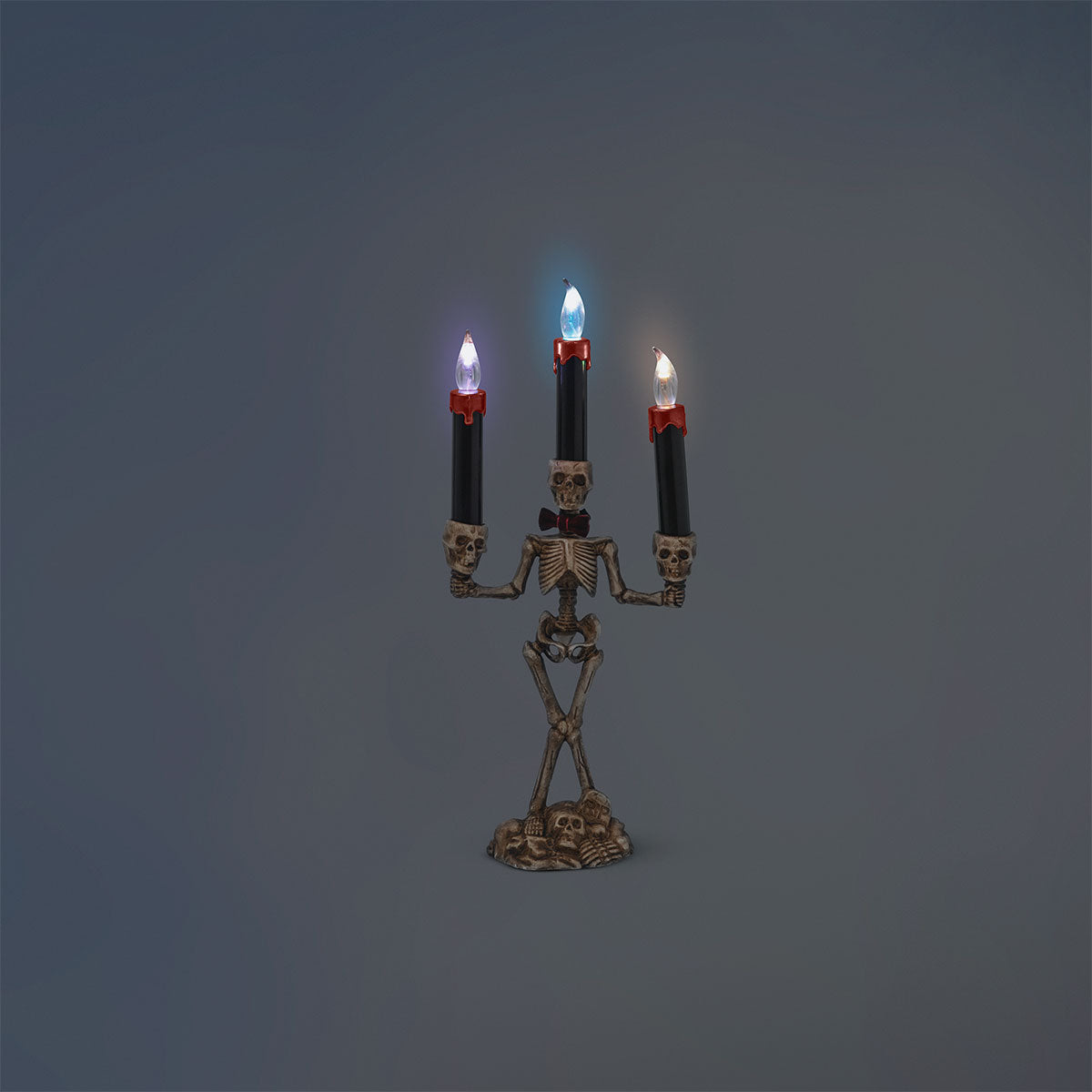 Skeleton candelabra gadget by Flying Tiger Copenhagen, 37 cm tall, featuring a spooky skeleton design with multiple candle holders.