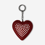 Foldable heart-shaped hairbrush with mirror by Flying Tiger Copenhagen, compact personal care accessory for on-the-go styling.