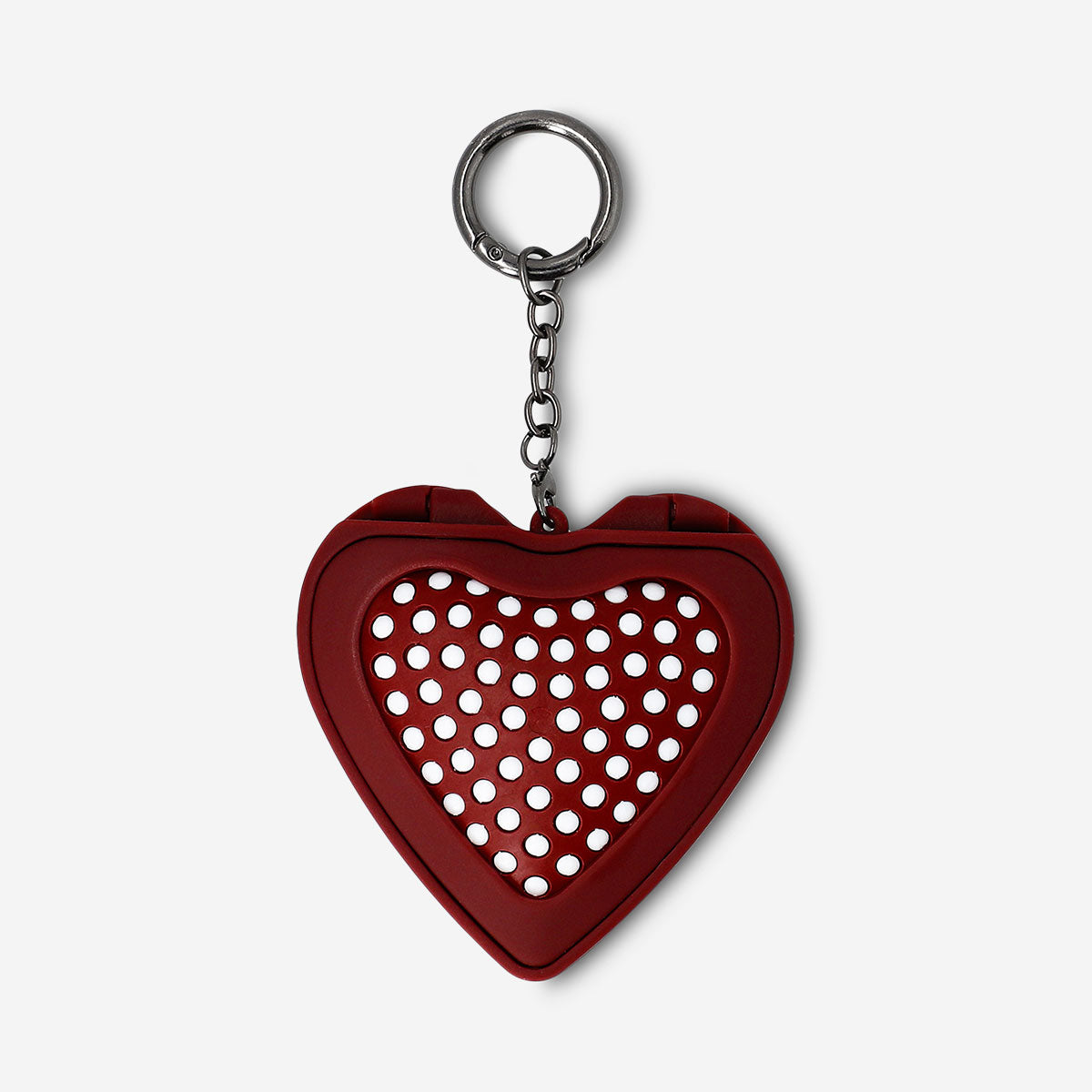 Foldable heart-shaped hairbrush with mirror by Flying Tiger Copenhagen, compact personal care accessory for on-the-go styling.