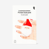 Flying Tiger Copenhagen pocket heat pad gadget featuring a festive Santa design, compact and portable for soothing warmth.