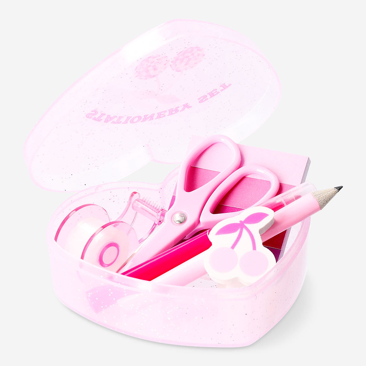 Office stationery kit in a heart-shaped box from Flying Tiger Copenhagen, featuring pens, paper, and small office supplies inside.