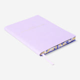 A5 lilac bullet planner with soft cover from Flying Tiger Copenhagen, showing the compact, stylish office organizer with pages inside.