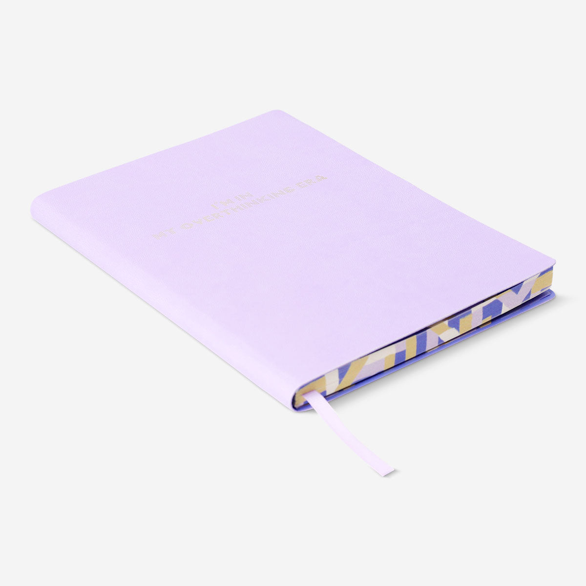 A5 lilac bullet planner with soft cover from Flying Tiger Copenhagen, showing the compact, stylish office organizer with pages inside.