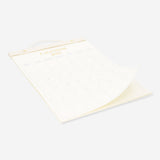 Hanging 2027 office monthly calendar by Flying Tiger Copenhagen with colorful grid layout on white background.