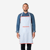 Adult kitchen apron with blue stripes by Flying Tiger Copenhagen, featuring adjustable neck strap and waist ties.