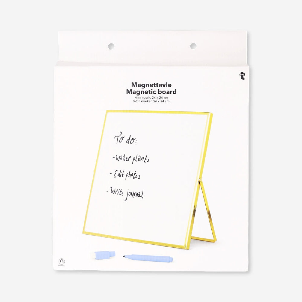 Gold magnetic office board with marker, featuring a sleek surface for notes and reminders, by Flying Tiger Copenhagen.