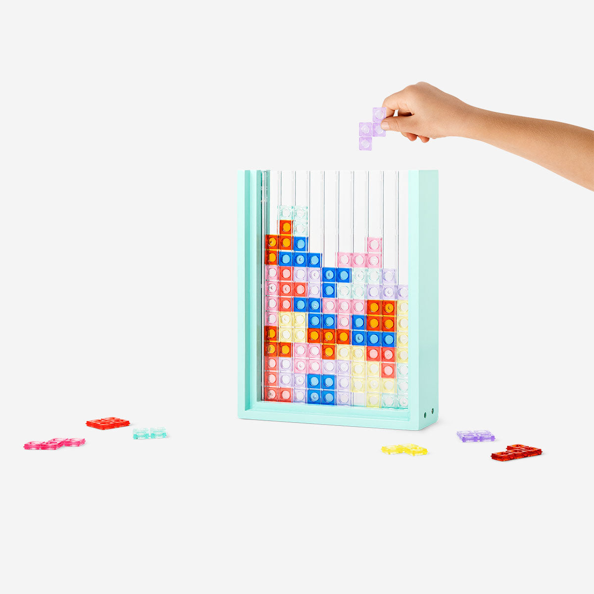 Flying Tiger Copenhagen 3D block puzzle game inside a frame, featuring colorful interlocking wooden pieces for brain-teasing fun.