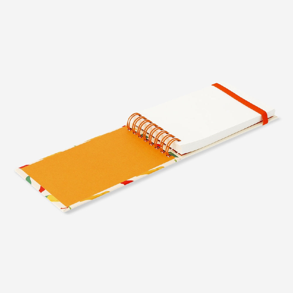 Flying Tiger Copenhagen office notepad featuring colorful chili pepper illustrations on the cover.