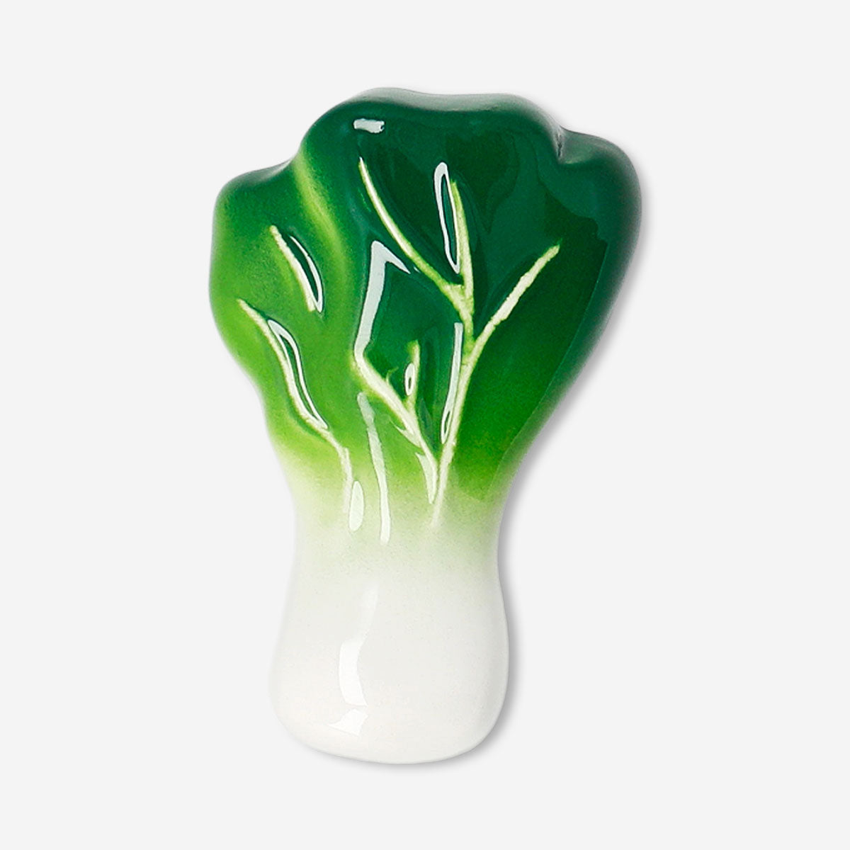 Kitchen chopstick holder shaped like Pak choi from Flying Tiger Copenhagen, made of ceramic with green leaves and white base.